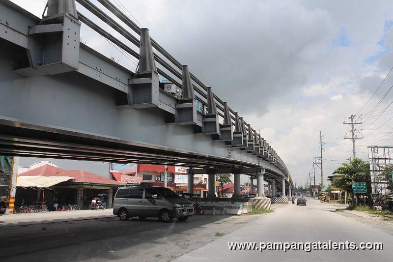Cars under the Lazatin Bridge along with the Jose Abad Santos Highway in the City of San Fernando Pampanga