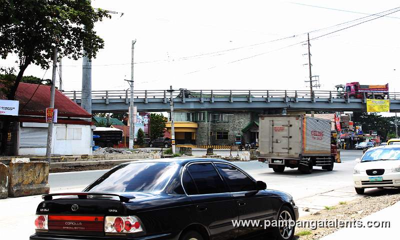 The Lazatin flyover crossing the Jose Abad Santos Avenue that gives access going to Bataan, Subic and Zambales.