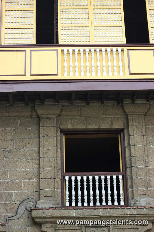 Capiz windows with wooden ballesters in Casa Manila