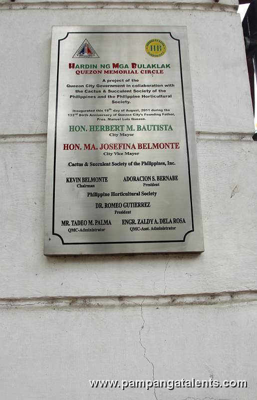 Marker of the Inaguration of the Hardin ng Mga Bulaklak or Flower Garden in Overview of Landscape with Orchids Flower Accent in Quezon Memorial Circle in Quezon City.