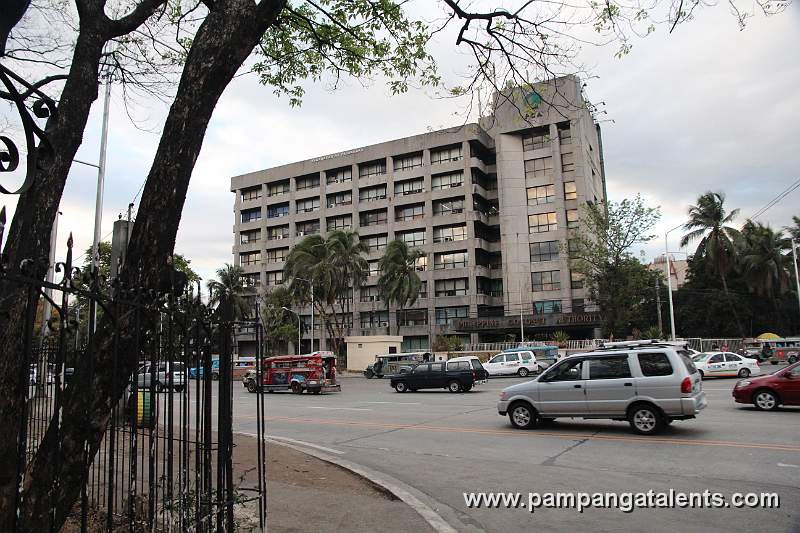 Traffic at Commonwealth Avenue Quezon City with Philippine Coconut Authority Building in Background.