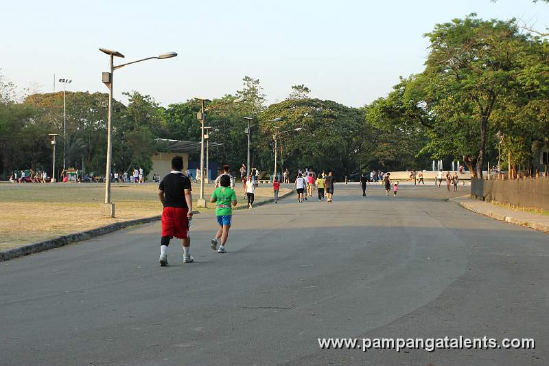 Joggers inside Quezon Memorial Circle.